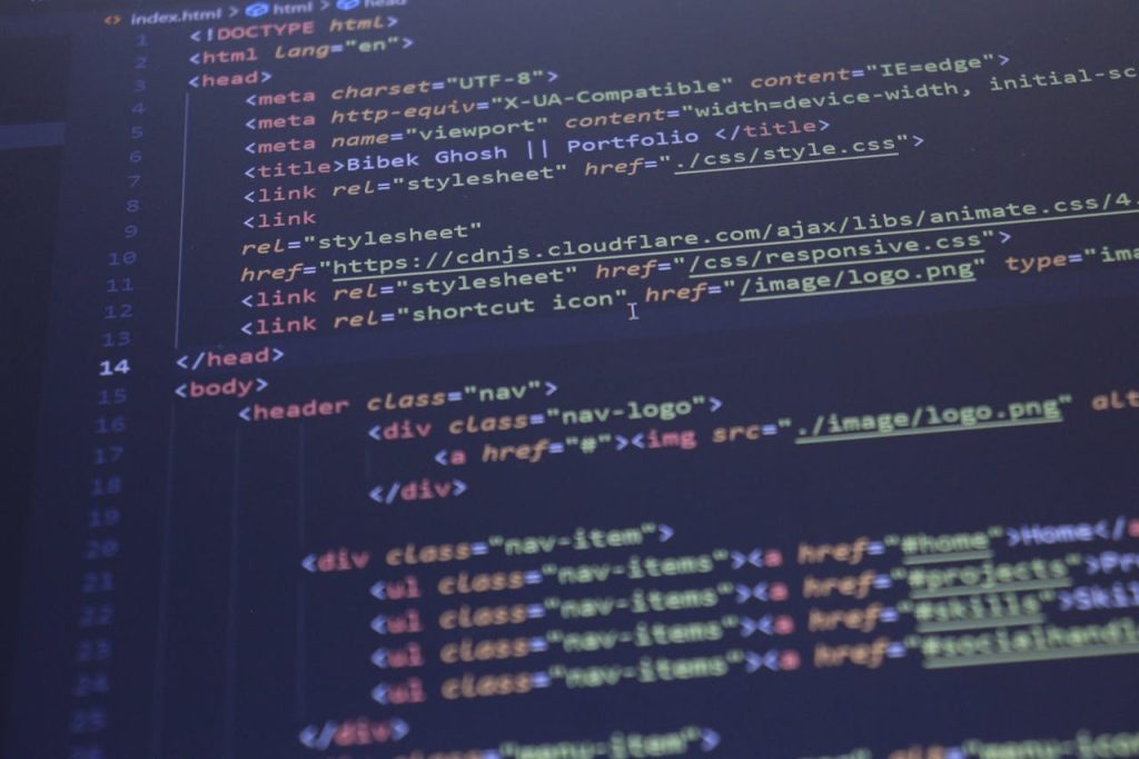 Close-up view of HTML and CSS code displayed on a computer screen, ideal for programming and technology themes.